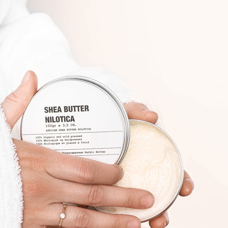 Taking Shea Butter Nilotica from Tin Can