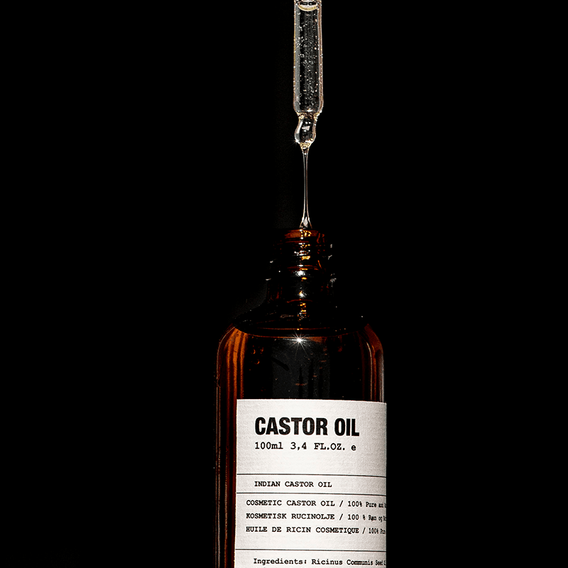 Shiny Castor Oil in Glass Bottle