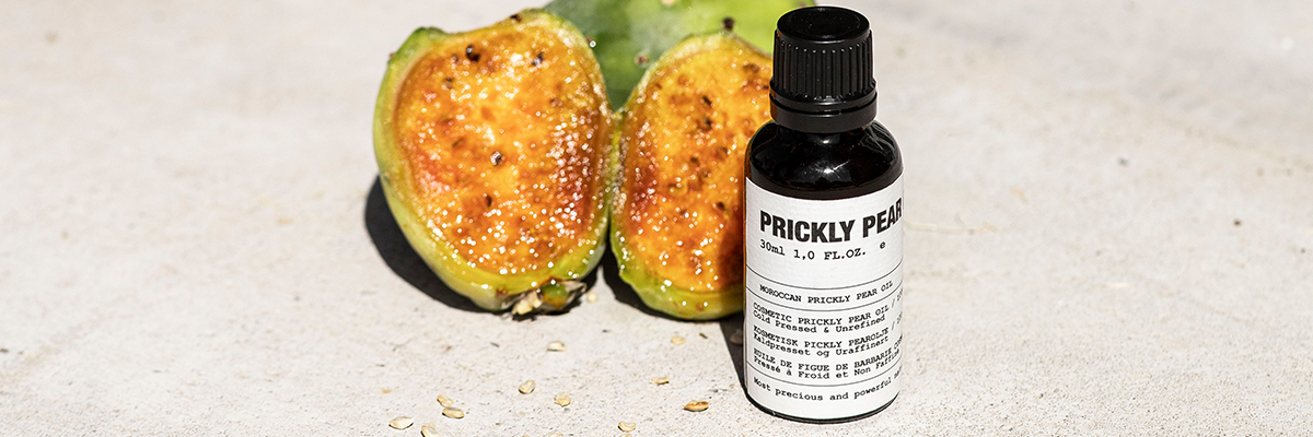 SAFWAH prickly pear oil next to a sliced fruit.
